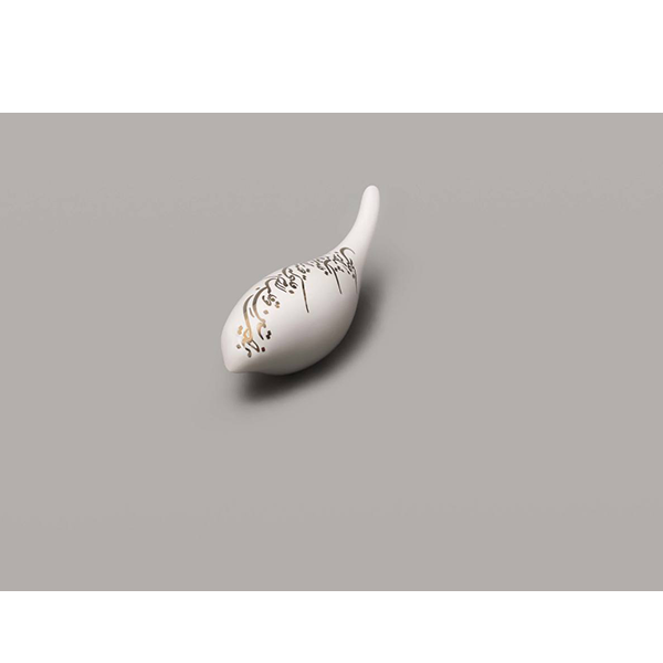 Ceramic bird with gold luster calligraphy